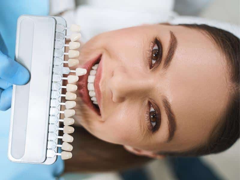 A smiling patient in a consult for porcelain veneers in Kirkland, WA
